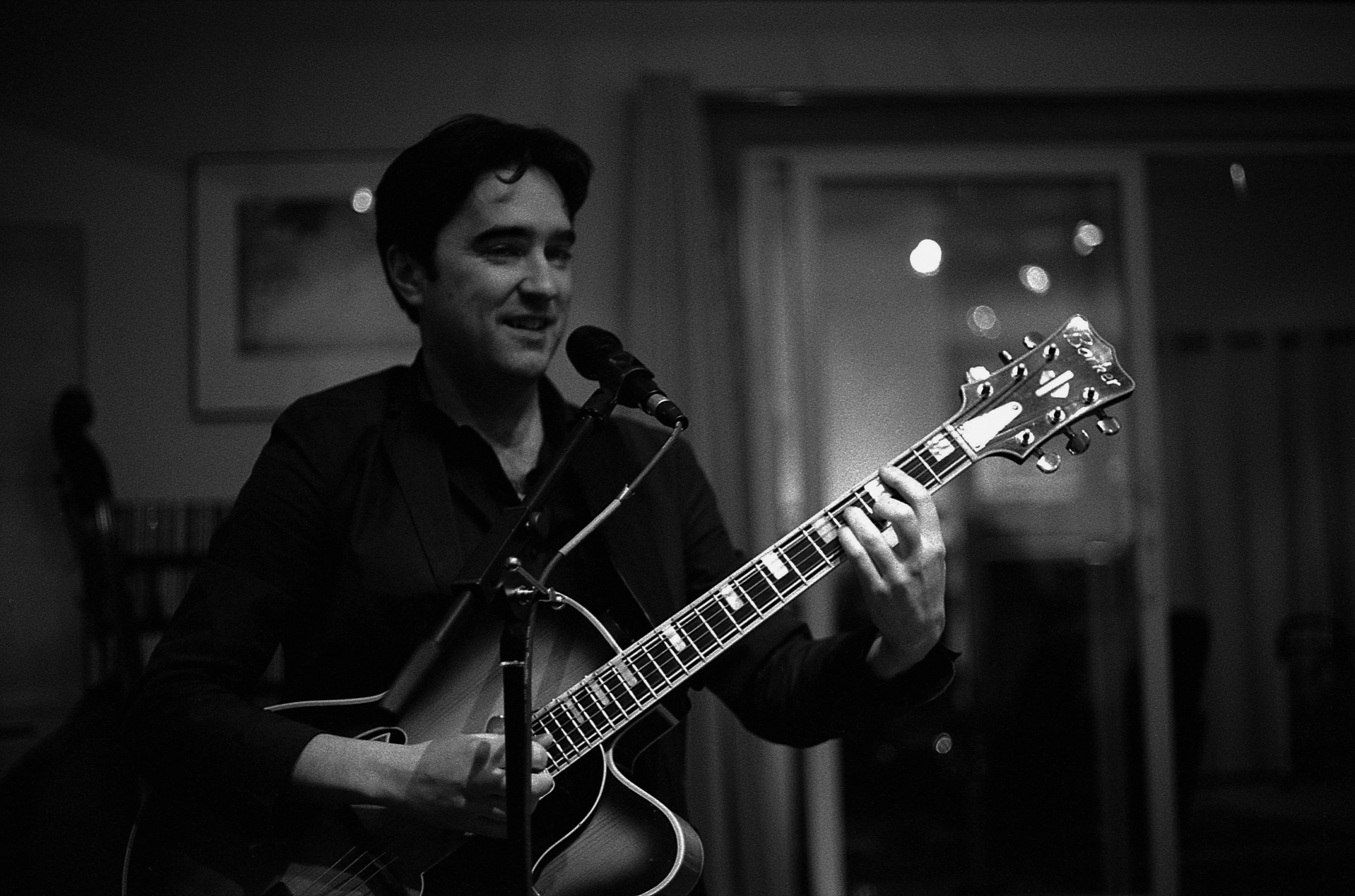 Andy playing & singing. Photo by Chris Baker.